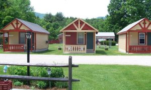 colorful cabins in a row on a lawn