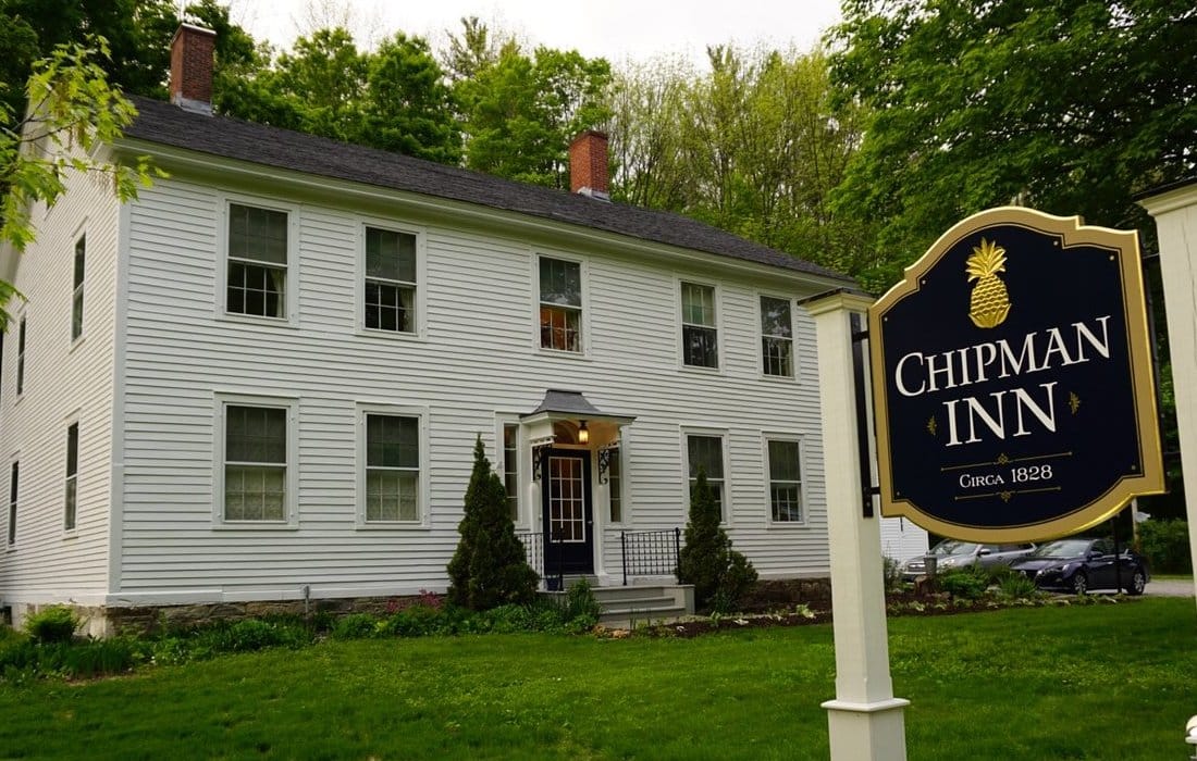 white colonial home with Chipman Inn sign